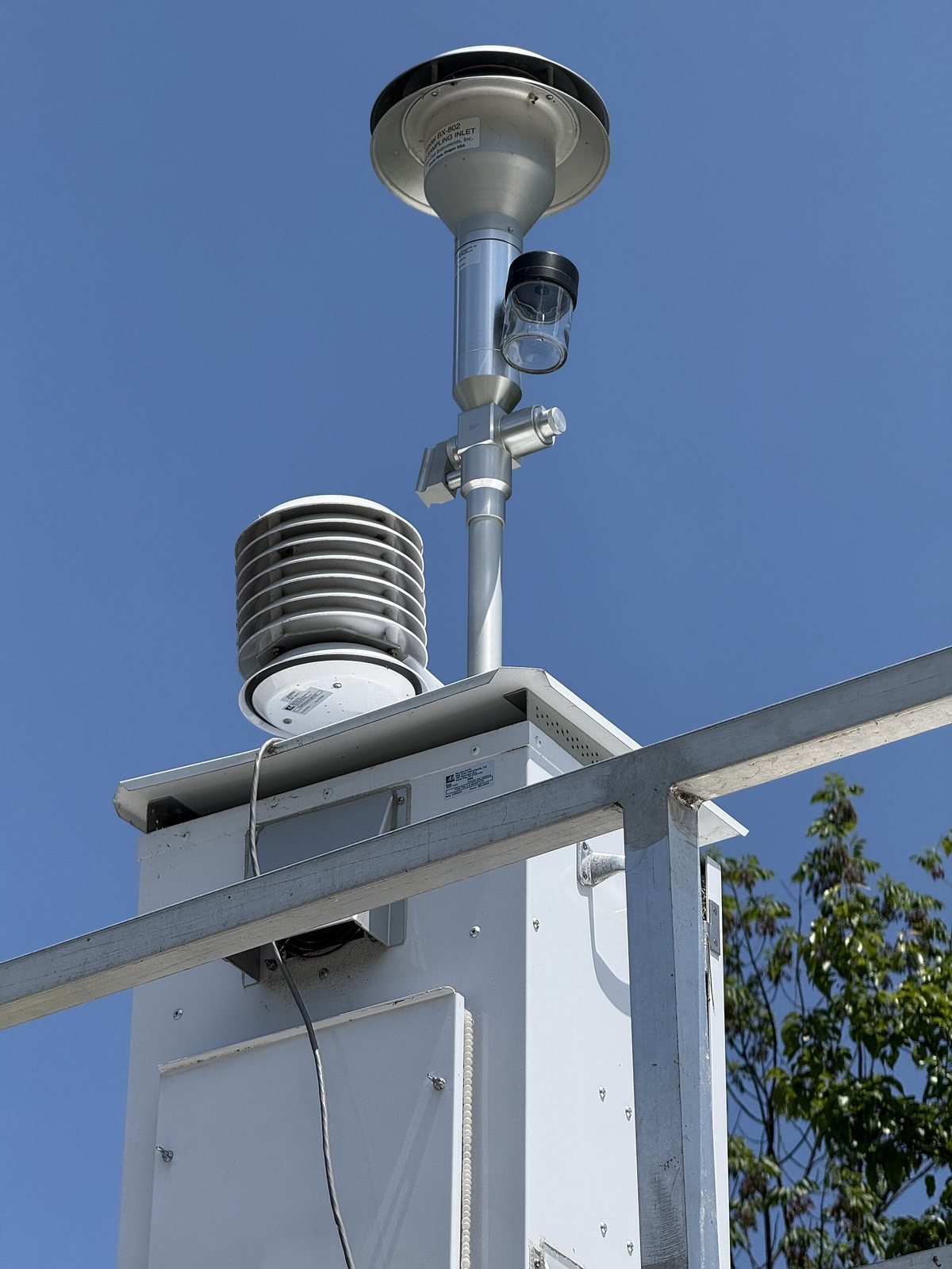 Sensor housings on the mast of an air monitoring station run by the New Jersey Department of Environmental Protection.