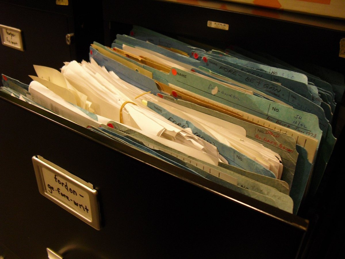 An open drawer of archived research files in coloured folders, from the making of the Dictionary of Old English.